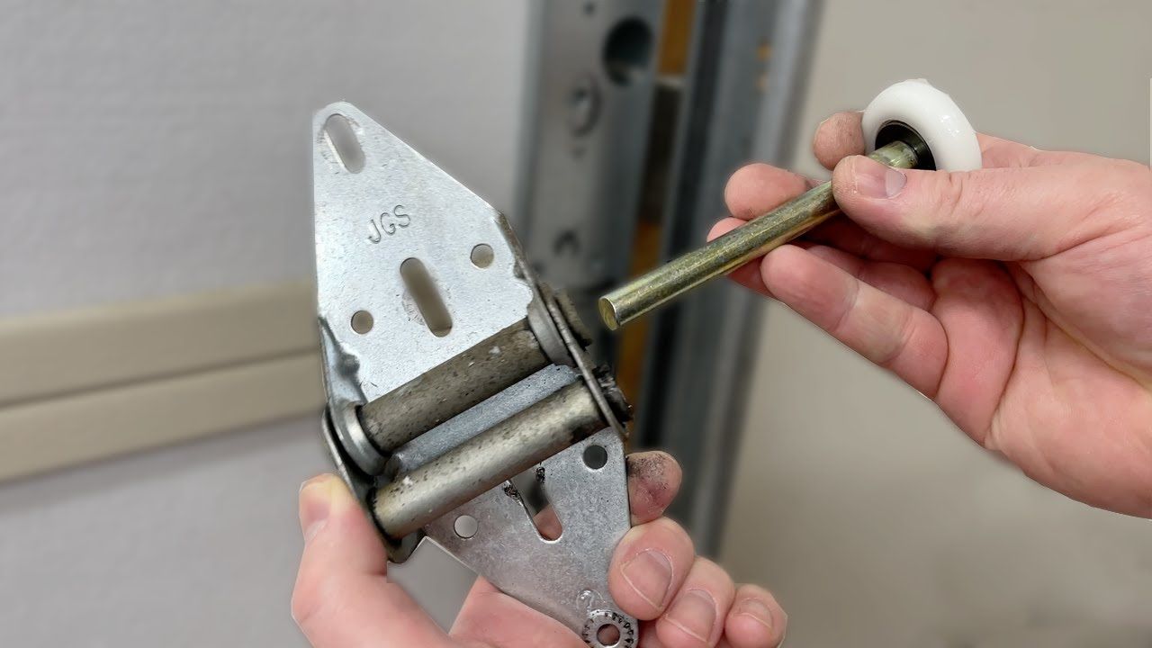 Garage door track and roller system close-up